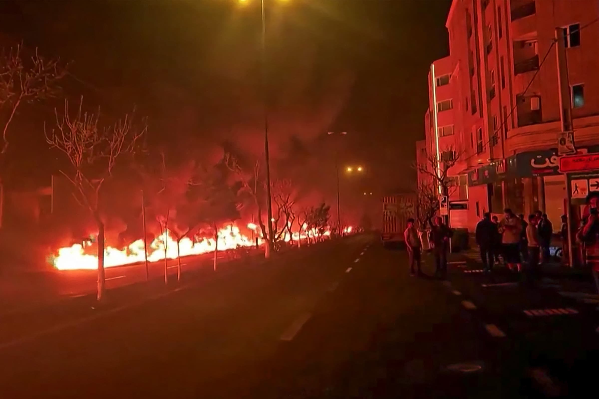 ภาพจากโซเชียลมีเดียเมื่อวันที่ 7 และ 8 มีนาคม 2026 แสดงให้เห็นเปลวไฟที่ลุกไหม้คลังน้ำมันในกรุงเตหะรานของอิหร่าน Photo by - / UGC / AFP