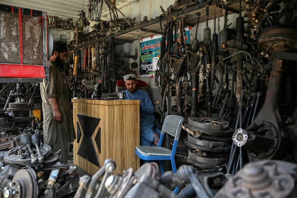 Afghan men working at a auto-parts shop in the Spin Boldak district of Afghanistan's Kandahar province