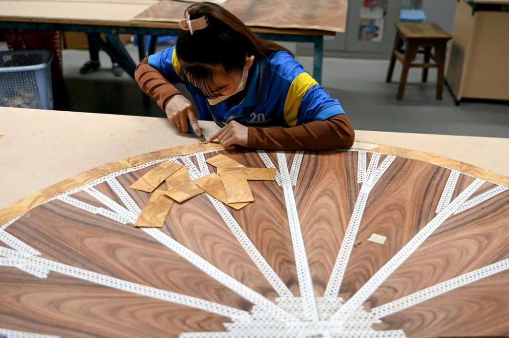 A worker at the Jonathan Charles Fine Furniture factory in Ho Chi Minh City in November 2025
