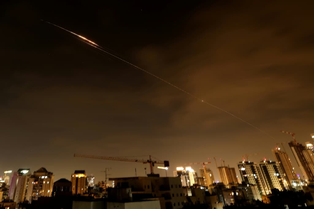 Rocket trails seen in the sky above the Israeli coastal city of Netanya early on Monday