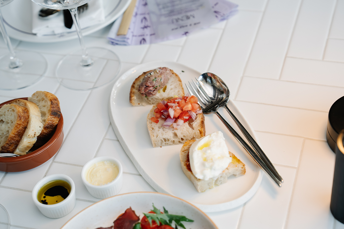 PhotoStory-Bruschetta trio, with beef tartare, classic tomato salsa and N_duja with burrata